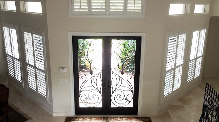 Honolulu foyer with glass doors and interior shutters